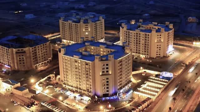 Aerial night view of Bahria Town towers